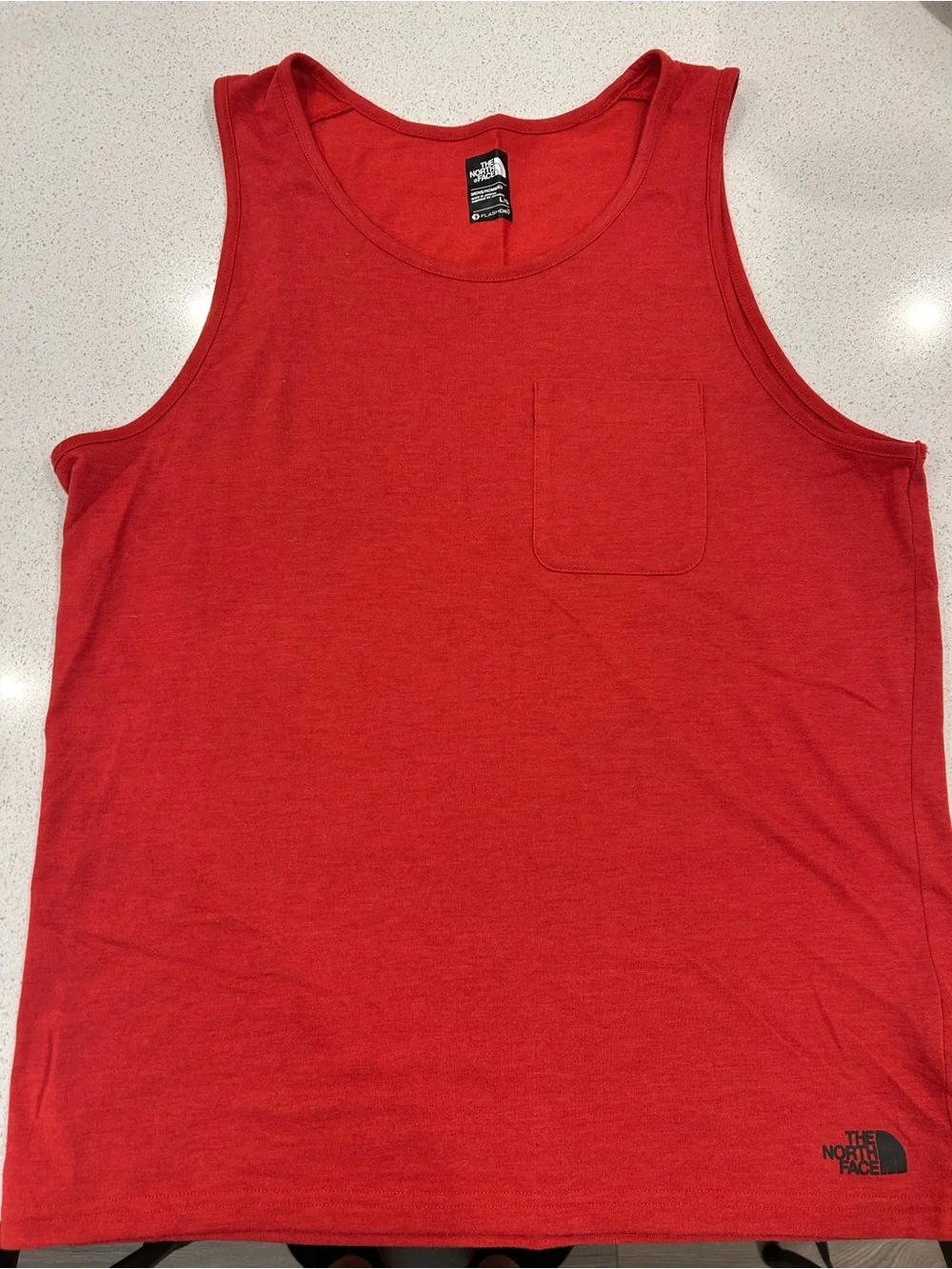 The North Face Red FlashDry tank with Black Logo Patch